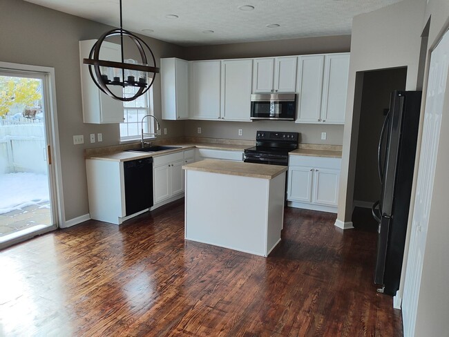 Photo - Beautifully maintained 4-bedroom, 2.5-bath over 2,200 sqft with a 2 car garage!