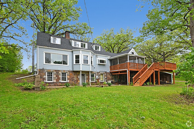 Enjoy serene views through the large back windows-perfect for soaking in nature or  cozy bonfires. - 32584 River Vista Ln Rental