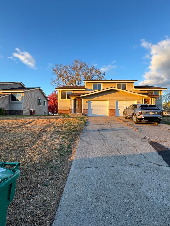 Outside currently with new garage doors - 5802 84th 1/2 Ave N