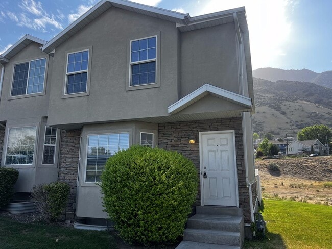Building Photo - Spacious End-Row Townhome