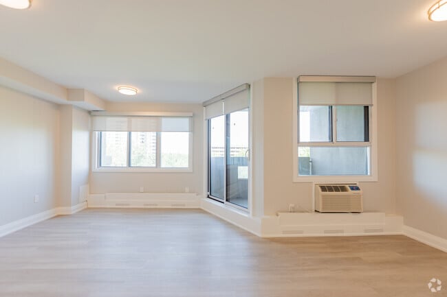 2BR + DEN, 1BA - 971SF - Living Room - The Forestwoods