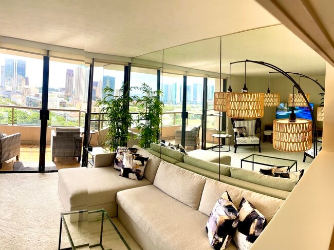 Living room has large L-shape sofa that unfolds to queen bed/storage