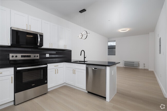2BR, 2BA - 1,005SF - Kitchen and Living Room