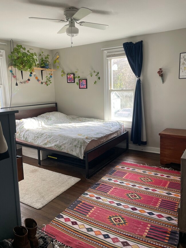 Bright bedroom with natural light and space for a queen-size bed. - 520 Commonwealth St