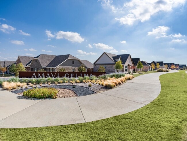 Landscaped pathways and a welcoming community entry set the tone for connected living among thoughtfully designed single-family homes in Celina.