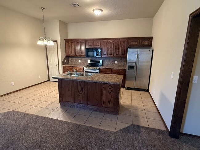 Photo - 3 bed duplex. New carpet, great kitchen Island and a fenced backyard in Moore schools!
