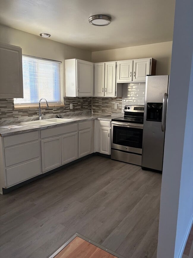 Photo - Charming 2-Bedroom Oasis with Spacious Front Yard!