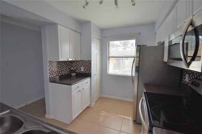 Photo - 10177 Sailwinds Blvd S Unit 203