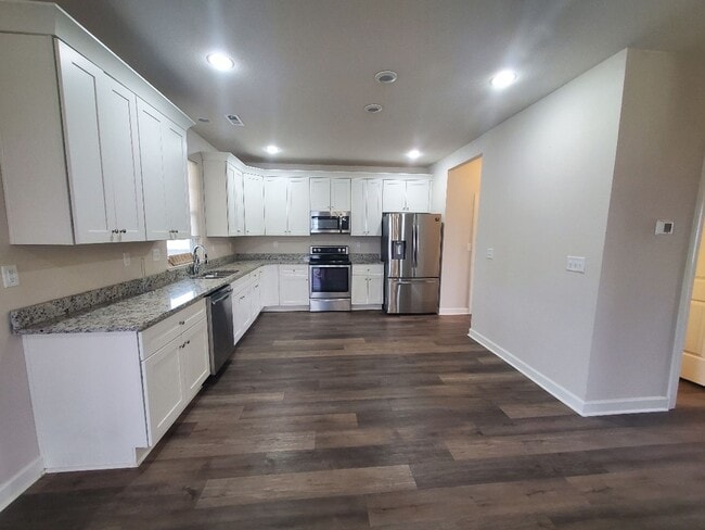 Photo - Luxurious 4BR/2.5BA Home with Spacious Living Spaces and Elegant Touches