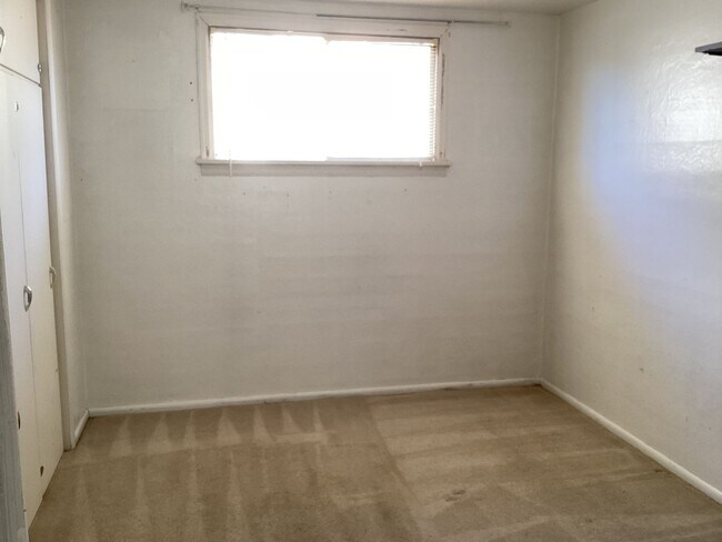 Photo - Charming 2BR Home with Spacious Yard, Detached Garage & Garden Oasis Unidad A