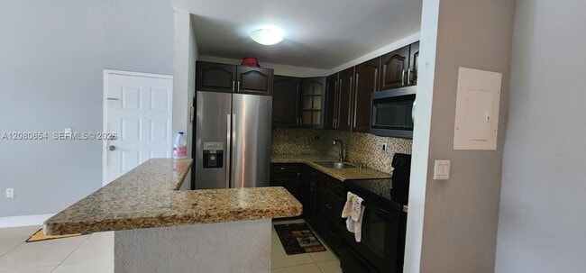 Building Photo - 7195 NW 179th St Unit 109