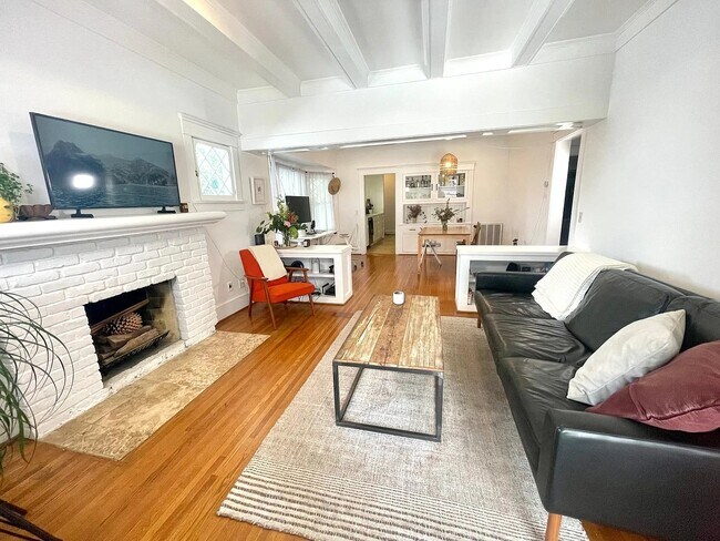 Open concept layout with a natural flow from the living room to the dining area. - 6000 Carlton Way