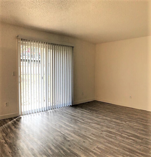hard floors in living areas/courtyard access - Michael Manor Apartments