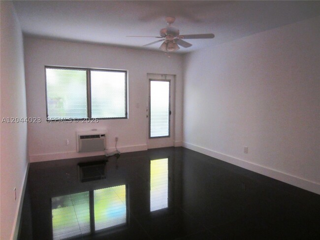 Building Photo - 8132 Harding Ave Unit 5