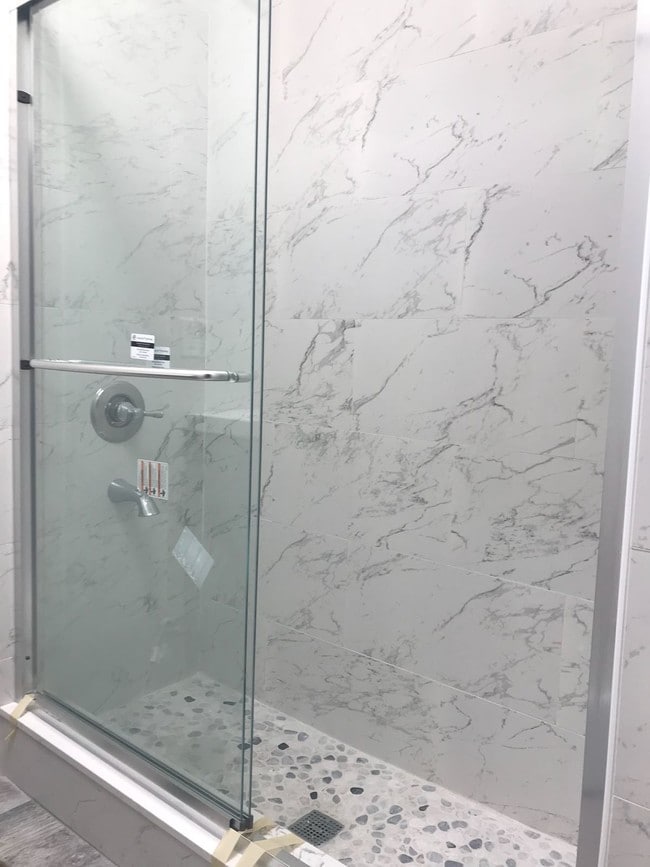 carrara tile, Delta fixtures - 1424 E Florida St Apartments Unit A