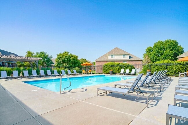 Sunny days are made for poolside fun! Lounge, play, or unwind in our inviting pool area. - Fountain Glen Rental