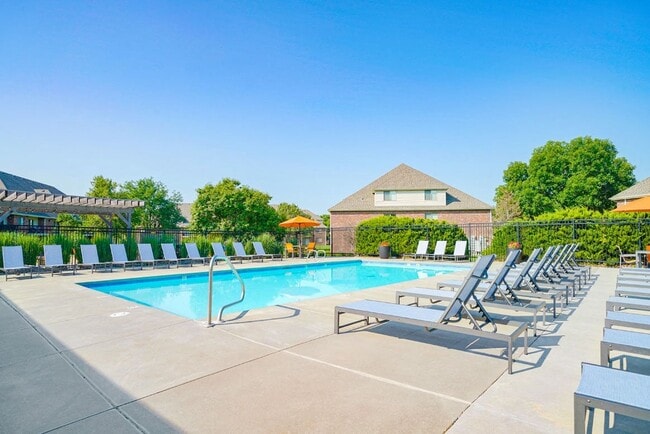 Sunny days are made for poolside fun! Lounge, play, or unwind in our inviting pool area. - Fountain Glen Rental