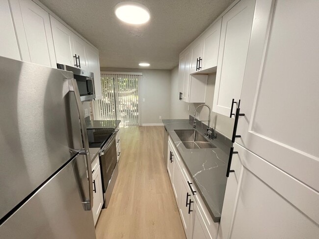 Photo - Ground Floor Two-Bedroom/One-Bathroom Cond... Unit H1