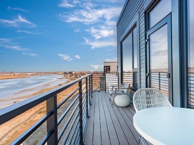 Enjoy your private balcony with sweeping water views and space to relax above the shoreline.