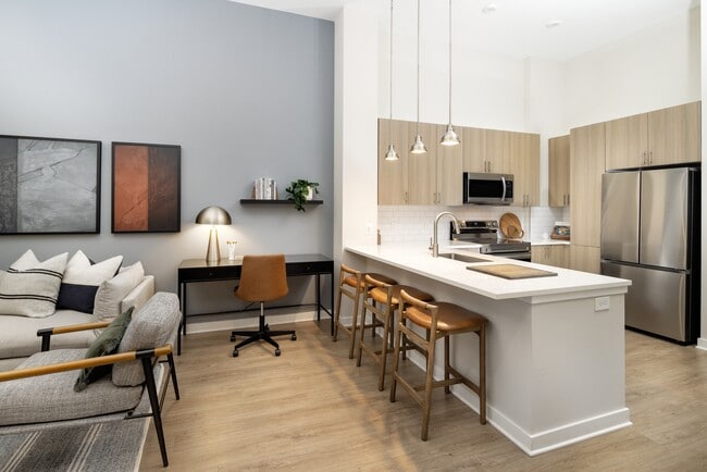 Kitchen and dining area with hard surface vinyl plank flooring