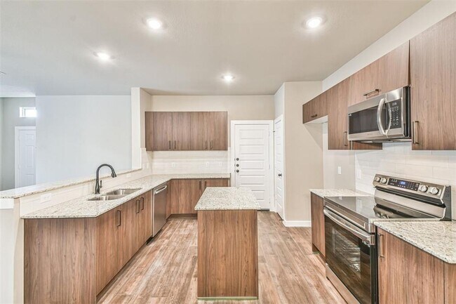 Photo - Modern 3-Bedroom Duplex with Granite Counters, Private Yard, and Prime Location