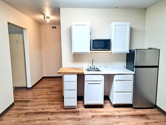 Photo - UNDER NEW MANAGEMENT: Accessible Studio w/ Laminate Floors! All-Inclusive "One Bill" Living, Free... Unit 3959 Sheridan Ave Apt 10