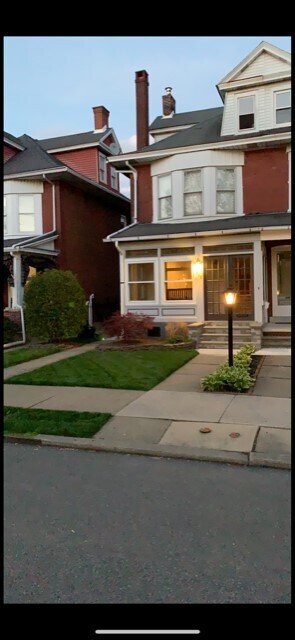 Front with covered porch, great for catching concerts or watching the snow fall! - 708 8th Ave Townhome