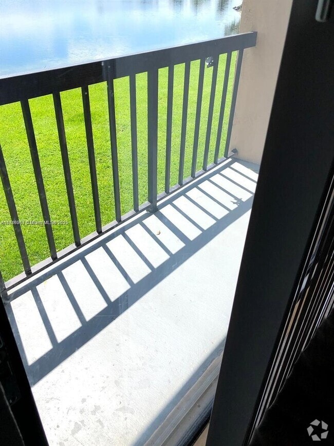 Building Photo - 6745 W 26th Dr Unit 203-4 Rental