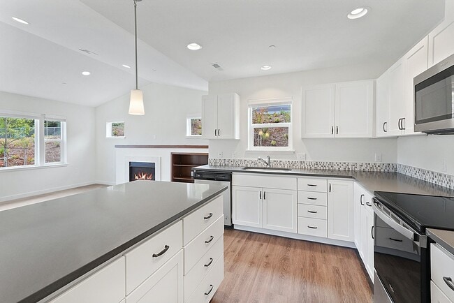 Great storage! Island kitchens with quartz countertops.