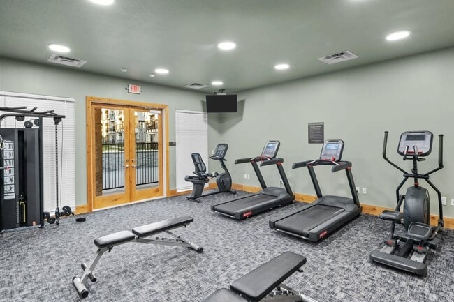 Elevate your fitness journey at Southgate Apartments, where our state-of-the-art gym awaits. Enjoy a bright, welcoming space equipped with modern cardio machines and weight training options. Start your new lifestyle today—schedule a tour now!
