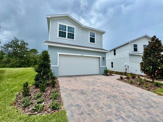 Building Photo - Brand-New 4BR Home with Tile Floors & Quar...