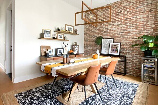 Dining room with brick accent wall! - 6201 Hyside Dr