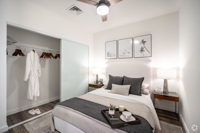 Bedroom with sliding frosted closet doors