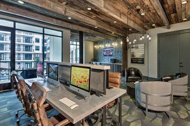 The business center with PCs, Macs, and a printer.