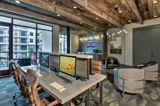 The business center with PCs, Macs, and a printer. - Windsor Fitzhugh