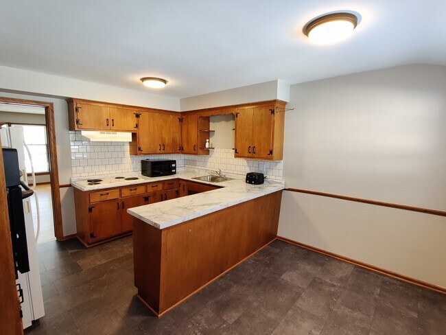 Kitchen with seating area - 4216 Valley View Rd Townhome