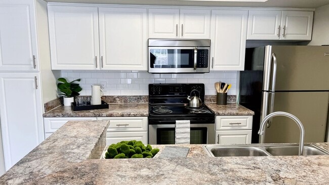 Our kitchens are spacious and stylish, boasting ample storage options, including a built-in pantry.