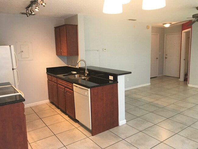 Photo - 2 Bedroom / 2 Bathroom Upstairs Condo with Large Screened Covered Porch