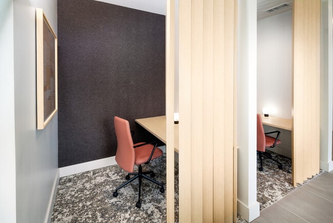 Cowork lounge with private work pods