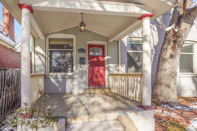 Photo - $2,100 - 2 bed, 1 Bath Townhome in Denver with AC, In Unit Laundry, and Yard!