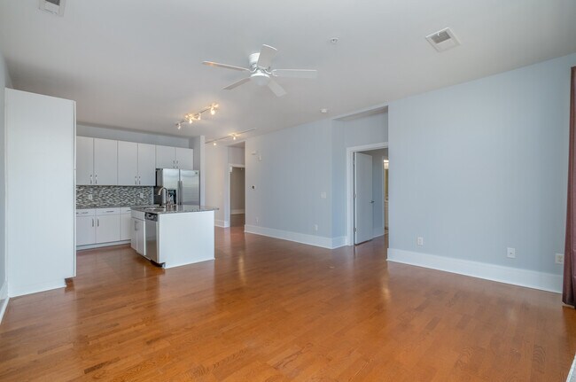 From the living room looking at the kitchen, dining area, doorways to the master and 2nd bedrooms - 1600 Fulton Ave Unit Fulton202