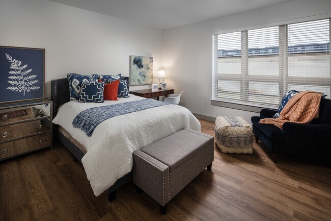Wood-style flooring throughout - Mill District Apartments