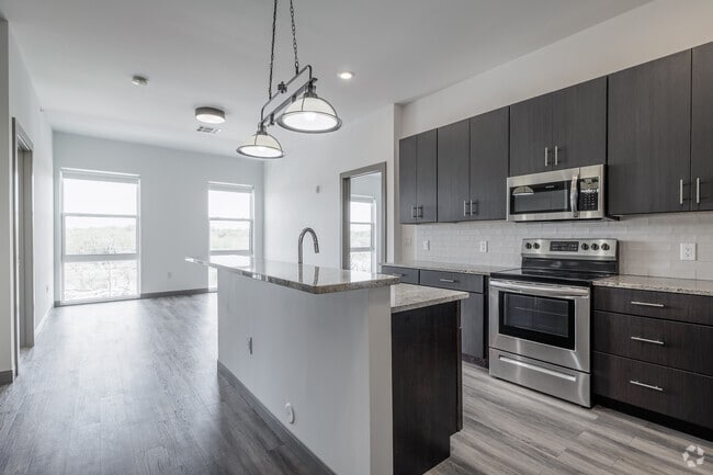 2BR, 2BA - 1,052SF - Kitchen and Living Room