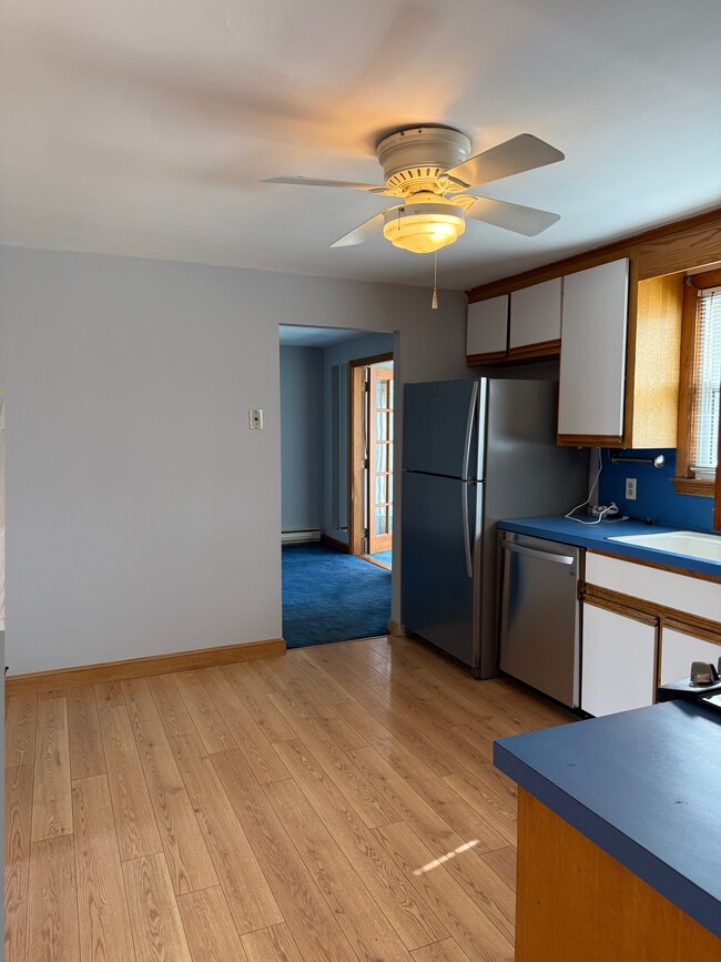 Kitchen opening to dining room - 87 Auburn St Unit 87 Auburn Street