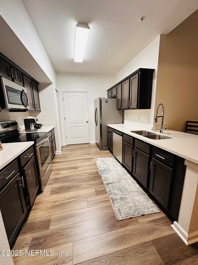 Building Photo - 4966 Key Lime Dr Unit 306 Rental