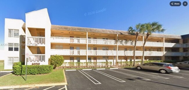 Building Photo - 6050 NW 64th Ave Unit 105