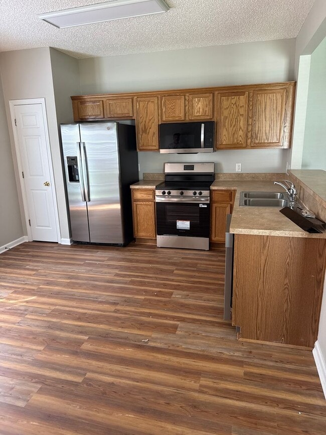 Photo - New floors, just painted, and all new appliances!!