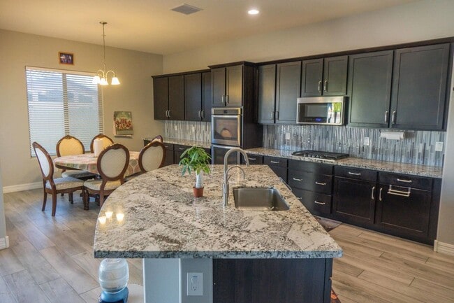 Photo - Gorgeous 4 Bed + den Single Level Home in gated community in North Peoria with RV Gate / BBQ!!