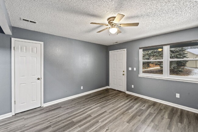 Photo - Charming Two-Story Home with Fenced Yard & Cozy Fireplace — Pet-Friendly!