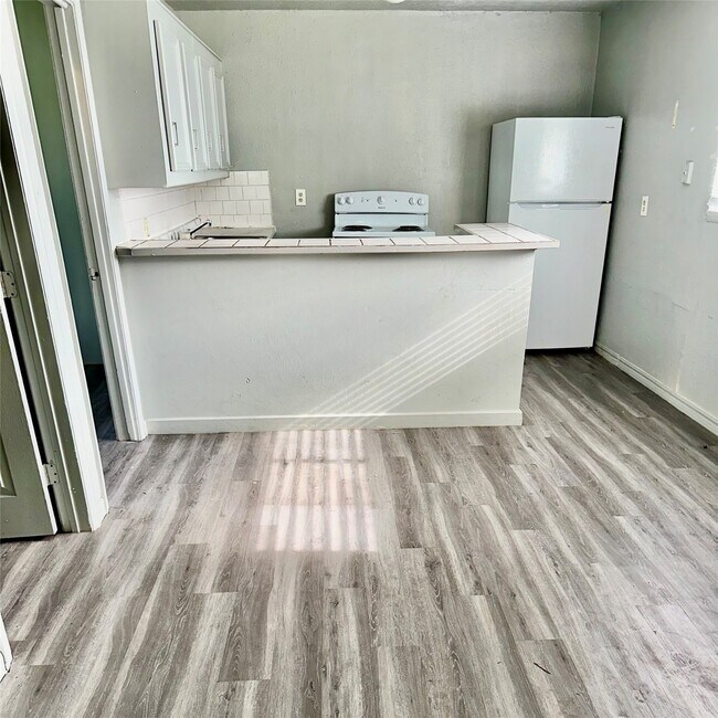 Building Photo - 5409 Suez St Unit 3